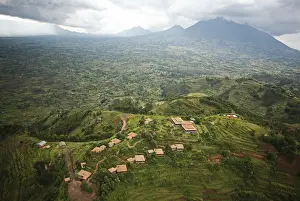 Development Prints: Rwanda. The luxurious Virunga Safari Lodge sits below looming volcanoes