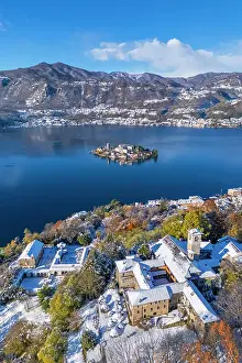 Isola Di San Giulio Prints: Sacro Monte of Orta and San Giulio island on Lake Orta in winter after a snowfall
