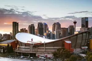 Images Dated 16th January 2018: Saddledome stadium and city skyline at sunset, Calgary, Alberta, Canada