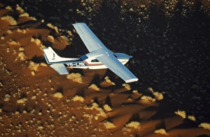 Shadow Gallery: Safari flights over red sand dunes of Sossusvlei