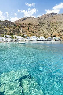 Images Dated 22nd April 2022: Sail boat in the turquoise crystal sea surrounding Loutro village, Crete island, Greece