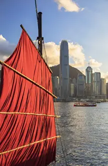 Sail of junk boat and skyline of Hong Kong Island, Hong Kong