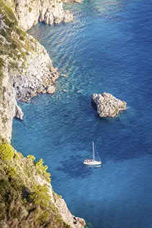 Capri Prints: Sailboat in blue bay at the Faraglione rocks on Capri, Capri Island, Gulf of Naples