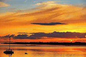 Strait Prints: Sailboat at sunset in Strait of Northumberland Wood Islands, Prince Edward Island, Canada