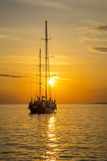 Sailing boat at sunset, Mykonos Town, Mykonos, Cyclade Islands, Greece