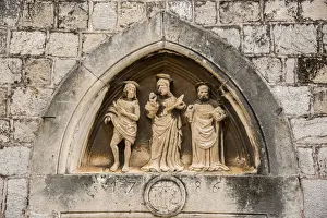 Ragusa Prints: The three saints statues carved above the entrance door of Church of St Luke, Dubrovnik