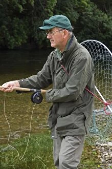 Images Dated 1st August 2006: A salmon fisherman fly fishing the Oak Tree Pool on