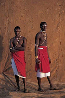 Tribal Collection: Samburu warriors, infront of muddy backdrop at Sunset, Laikipia Kenya