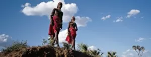 Tribal Jewellery Collection: Two Samburu warriors resplendent with long Ochred braids
