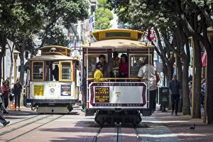 Images Dated 22nd July 2015: San Francisco, California, USA. Two cable cars in the streets of Frisco, one of the