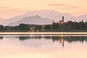 San Giuseppe Church and Bosisio Parini lakefront reflected in the Pusiano lake with