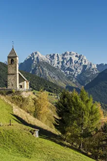 San Leonardo church with the Dolomites in the background, Comelico Superiore, Veneto