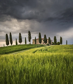 Fields Gallery: San Quirico d Orcia, Tuscany, Italy. Farmhouse at sunset