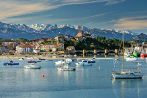 San Vicente de la Barquera with the snowy Picos de Europa mountains in the backdrop, Cantabria, Spain