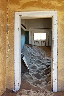 Abandoned Prints: Sand banked inside a room in abandoned diamond mining town