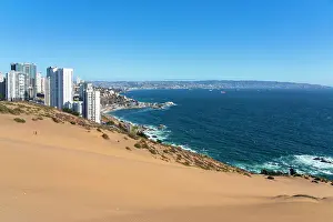 Residential Building Prints: Sand dunes with high-rise buildings on coast and distant view of Vina del Mar and Valparaiso