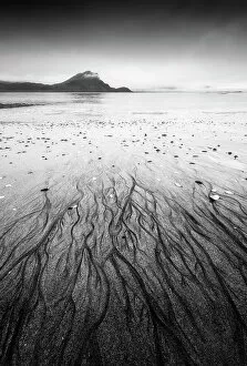 B And W Collection: Sand patterns create an eye-catching foreground at Haukland beach on a gloomy summer morning
