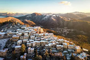 Santa Maria del Monte after a snowfall in winter at sunrise. Varese, Parco Campo dei Fiori, Lombardy, Italy