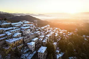 Images Dated 27th February 2023: Santa Maria del Monte after a snowfall in winter at sunrise. Varese, Parco Campo dei Fiori