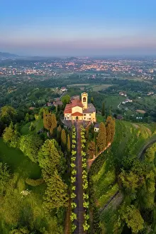 Vine Prints: Santuario della Beata Vergine del Carmelo at the top of a hill at sunset in spring