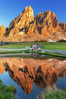 Images Dated 31st October 2022: Sass de Putia reflection in the water of a small lake at sunset, Passo delle Erbe, Dolomites