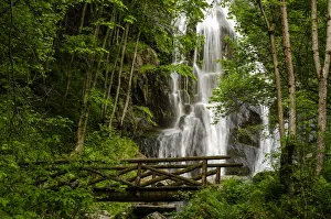 Torrent Prints: Saut waterfall and the wooden bridge in Pesio Valley, Chiusa Pesio, Piedmont, Italy