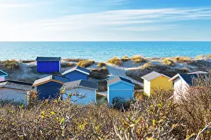 Wealth Prints: Scenic view of colourful beach huts against blue sky on the beach of Tisvildeleje