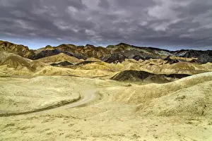Dirt Road Prints: Scenic view over multicolored badlands at Twenty Mule Team Canyon, Death Valley National