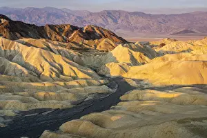 Desolate Prints: Scenic view of natural rock formations at Zabriskie Point during sunrise