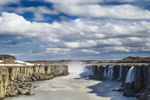 Images Dated 20th September 2019: Scenic view of Selfoss waterfall amidst rocky cliffs against cloudy sky, Northeast