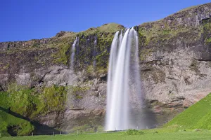 Seljalandsfoss Prints: Scenic view of Seljalandsfoss waterfall on rocky cliff, South Iceland, Iceland