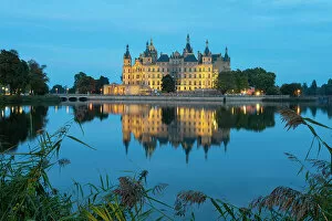 Palaces Collection: Schwerin Castle with reflection on Burgsee at twilight, Schwerin, Mecklenburg