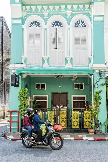 Scooter Prints: Scooter riding past beautiful buildings in the Old town, Phuket, Thailand