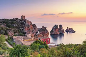 Scopello, Sicily. Elevated view of the tonnara and the sea stacks at dawn