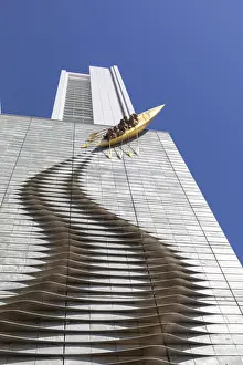 Central Prints: A sculpture of a canoe climbing a highrise building in Central Osaka, Osaka, Kansai