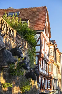 Sculptures of animal heads and half-timbered buildings, Marburg, Hesse, Germany