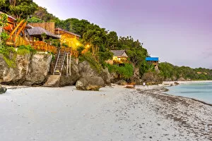 Sea cottages on the beach at dusk, Beach, Bira, Sulawesi, Indonesia