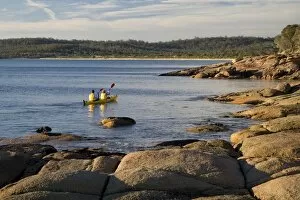 Paddle Gallery: Sea kayakers in Coles Bay on the Freycinet