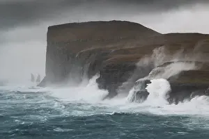 Denmark Prints: one sea storm hits the Risin og Kellingin cliffs during an autumn day