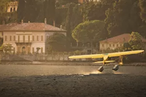 Images Dated 6th October 2021: A seaplane taking off in Como Lake at sunset. Lombardy, Italy