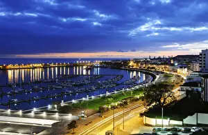 Seaside main avenue, marina and harbour of Ponta Delgada in twilight