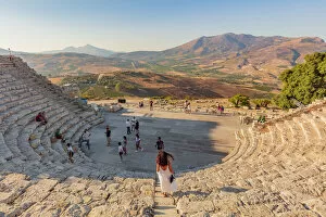 Segesta, Sicily. Tourists visiting the theater of Segesta at sunset