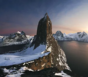 Segla mountain rising above the fjord during a winter sunset, Senja island, Norway
