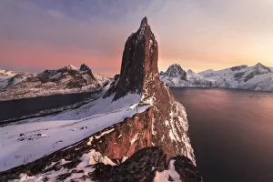 Images Dated 13th July 2020: Segla mountain rising above the fjord during a winter sunset, Senja island, Norway