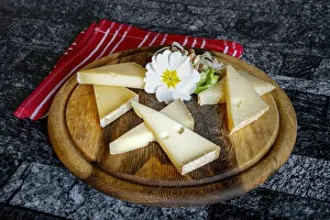 Images Dated 18th May 2021: Selection of typical italian cheese in wood chopping board