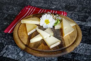 Selection of typical italian cheese in wood chopping board