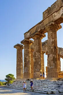 Columns Gallery: Selinunte, Sicily. Tourists visiting the Greek temple at sunset