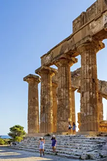 Selinunte, Sicily. Tourists visiting the Greek temple at sunset