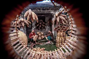 Craft Prints: Senior women making traditional bamboo fish traps, Hanoi, Vietnam. (MR)