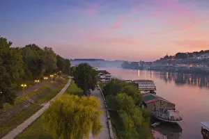Serbia, Belgrade, View of floating bars and nightclubs on Sava River across to Victor